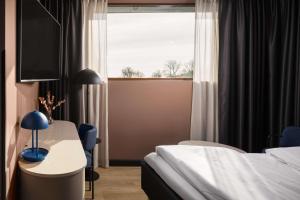 Letto o letti in una camera di Scandic Sarpsborg