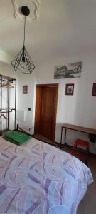 Posteľ alebo postele v izbe v ubytovaní La Casa dei Bersaglieri