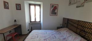 Posteľ alebo postele v izbe v ubytovaní La Casa dei Bersaglieri