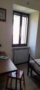 Posteľ alebo postele v izbe v ubytovaní La Casa dei Bersaglieri