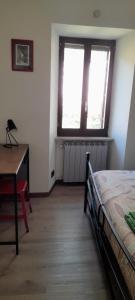 Posteľ alebo postele v izbe v ubytovaní La Casa dei Bersaglieri