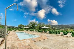 a swimming pool in a villa with a view at Mas Tarres L'olivera Madremanya in Madremanya