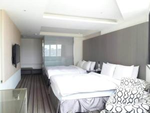Una cama o camas en una habitación de de rěve Express Hotel
