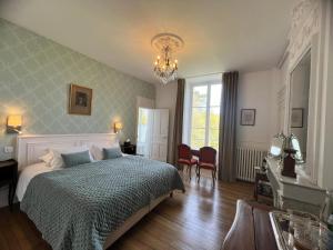 Postel nebo postele na pokoji v ubytování Château du Rondon