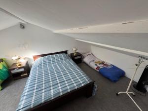 Ένα ή περισσότερα κρεβάτια σε δωμάτιο στο Chambre à la campagne