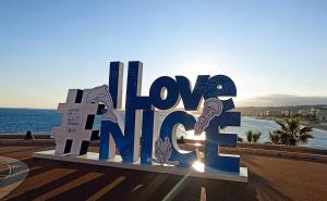 a large sign that says love nirvana at Le Fontana in Nice