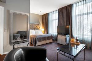 TV a/nebo společenská místnost v ubytování Clarion Hotel Ernst