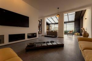 TV a/nebo společenská místnost v ubytování Casa Upupa