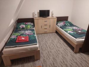 Posteľ alebo postele v izbe v ubytovaní Apartmány Morávka