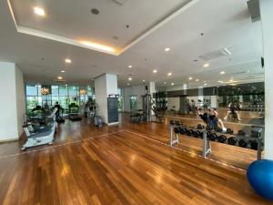 a gym with a hard wood floor and people exercising at Regalia Hostel Free Infinity Skypool Free in Kuala Lumpur