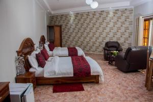 Postel nebo postele na pokoji v ubytování Inn Paradise Hotel