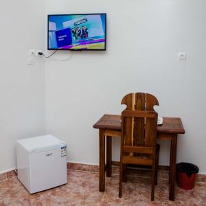 TV a/nebo společenská místnost v ubytování Inn Paradise Hotel