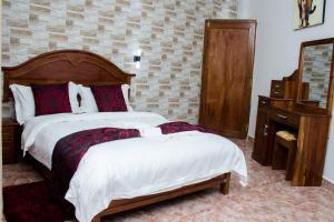 Postel nebo postele na pokoji v ubytování Inn Paradise Hotel