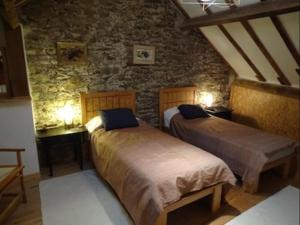 Ένα ή περισσότερα κρεβάτια σε δωμάτιο στο La Maison du Potier