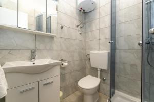 a bathroom with a toilet and a sink and a shower at Villa K&F Borik in Zadar +42 photos
