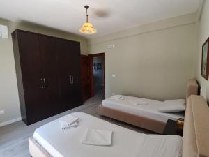 Postel nebo postele na pokoji v ubytování Leatis Apartment