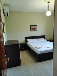 Postel nebo postele na pokoji v ubytování Leatis Apartment