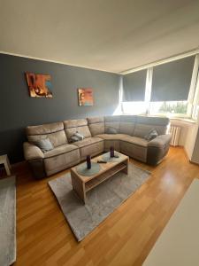 a living room with a couch and a coffee table at Wohnglück 2 in Herten