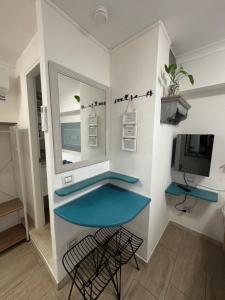TV a/nebo společenská místnost v ubytování Lu Bàtil B&B - Rooms
