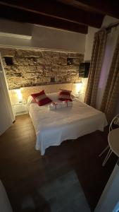 Postel nebo postele na pokoji v ubytování Lu Bàtil B&B - Rooms