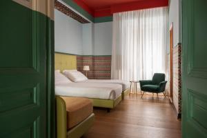 Postel nebo postele na pokoji v ubytování Hotel Oceania