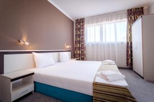 Ένα ή περισσότερα κρεβάτια σε δωμάτιο στο Hotel Oasis Del Mare