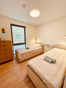 Postel nebo postele na pokoji v ubytování Color Stay Nida - cozy 2 bedroom appartment