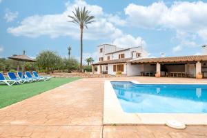 a villa with a swimming pool and a house at Finca Sant Blai Nou in Campos