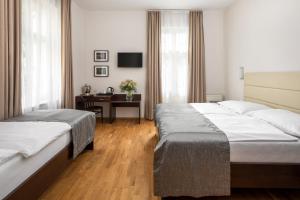 Postel nebo postele na pokoji v ubytování Hotel Unique