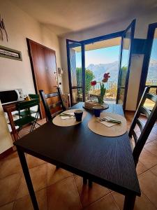 a dining room with a table with a view at residenza gelsomino - relax and view in Bellano +19 photos