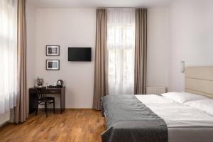 Postel nebo postele na pokoji v ubytování Hotel Unique