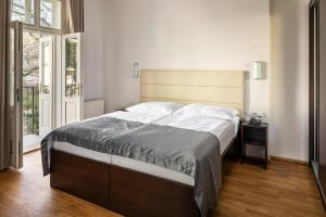Postel nebo postele na pokoji v ubytování Hotel Unique