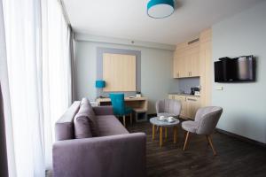 TV a/nebo společenská místnost v ubytování Hotel Regnum Residence + 37 fotografií