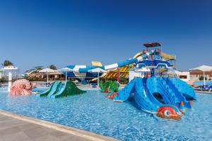 a water park with several slides in the water at Sunrise Alora Aqua Park Resort in Hurghada