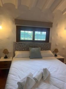 Postel nebo postele na pokoji v ubytování Villa Portitxol en Moraira