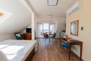 Postel nebo postele na pokoji v ubytování Hotel Orion