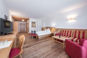 TV a/nebo společenská místnost v ubytování Hotel Torgglerhof