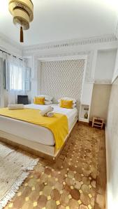Postel nebo postele na pokoji v ubytování Riad magnolia privé