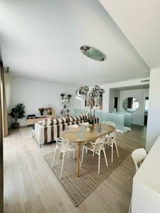 a living room with a table and a couch at Villa NewRay in Finestrat
