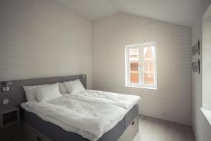 Postel nebo postele na pokoji v ubytování Sandhamn Seglarhotell
