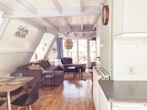 a living room with a couch and a table at Chalet 139 Hakuna Matata in Durbuy