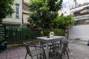 a table and two chairs sitting on a patio at Sophia's Apartment in Kalamata +35 photos