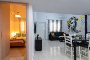 a room with a living room and a dining room at Sophia's Apartment in Kalamata
