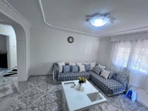 a living room with a couch and a table at Narcis House in Thessaloniki