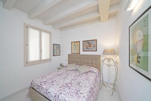 Posteľ alebo postele v izbe v ubytovaní Resort Caesar C4 Sirmione - Gardagate