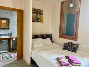 Postel nebo postele na pokoji v ubytování Masia Katmandu