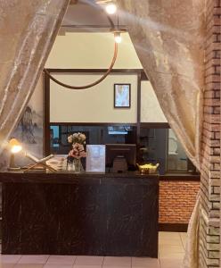 a view of a counter with a large mirror at Heritage House 123 in George Town