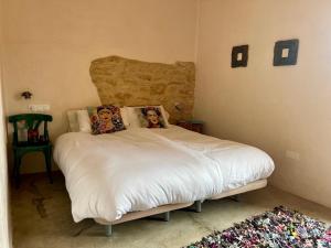 Postel nebo postele na pokoji v ubytování Masia Katmandu
