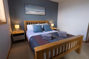Postel nebo postele na pokoji v ubytování Botaira, Shetland Islands