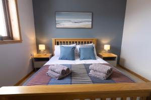 Postel nebo postele na pokoji v ubytování Botaira, Shetland Islands
